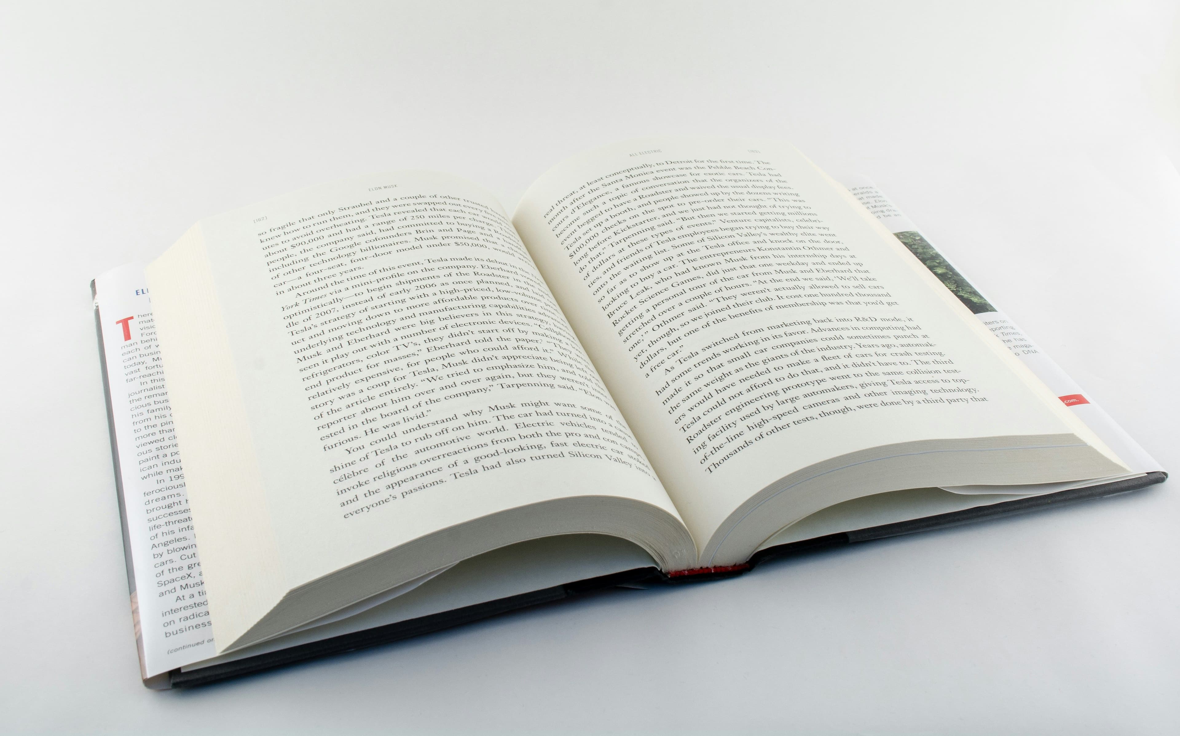 an open book sitting on top of a white table